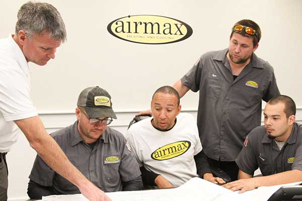 Airmax technicians going over blueprints