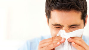 Man Dealing With Dust Mite Allergies