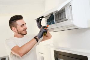 Technician Inspecting Ductless System