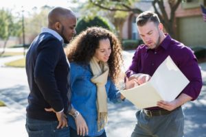 Couple Talking To Contractor