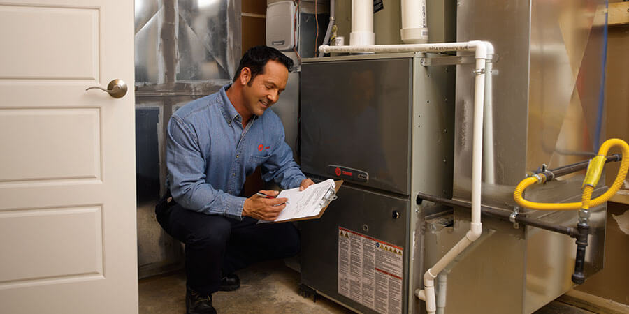 technician checking heating unit