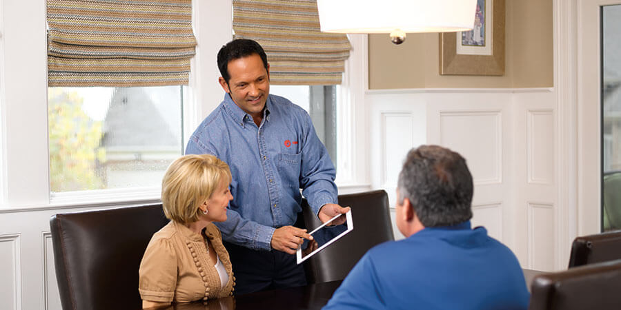 Trane technician talking with customers